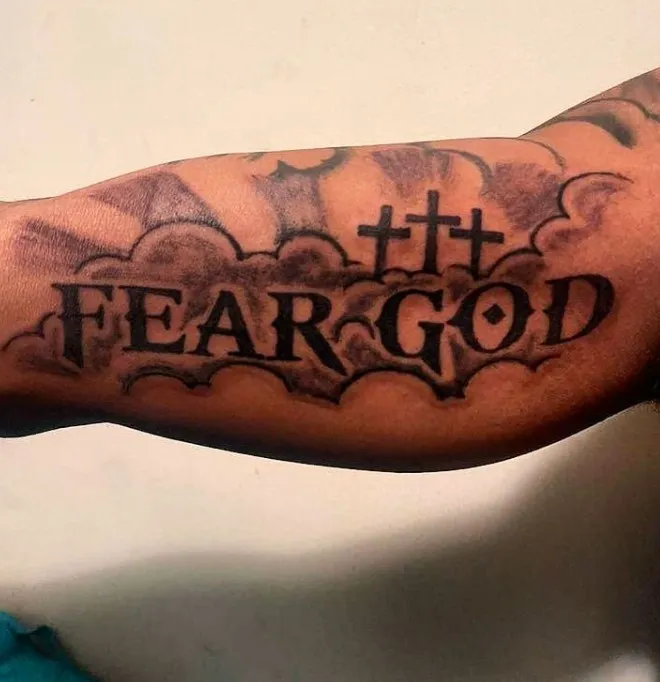 fear god tattoo with 3 crosses