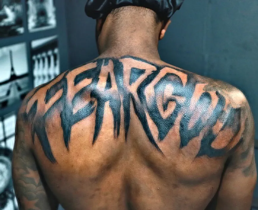 fear god tattoo on the back