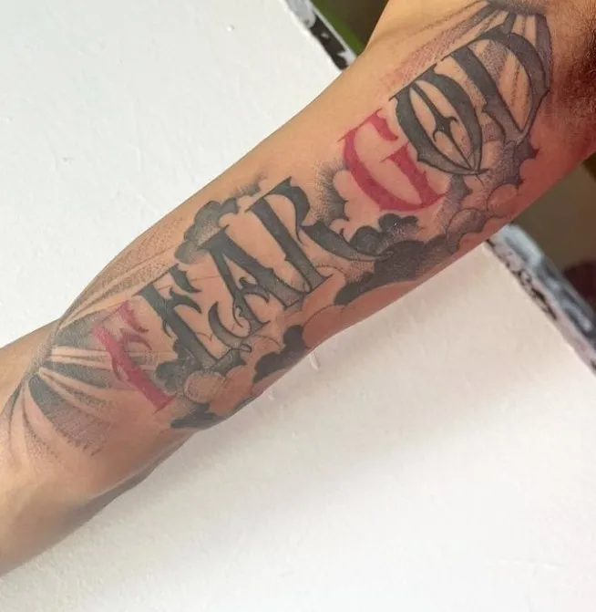 fear god tattoo on arm