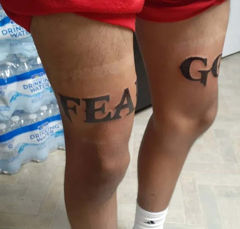 fear god leg tattoo