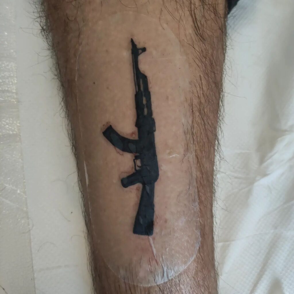 Black Inked Ak 47 Tattoo
