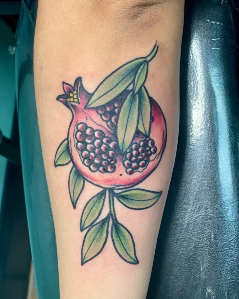 Pomegranate tattoo with seeds