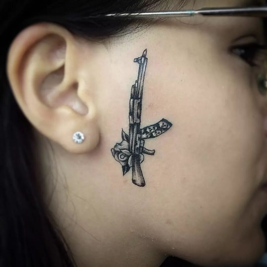 ak 47 tattoo on face