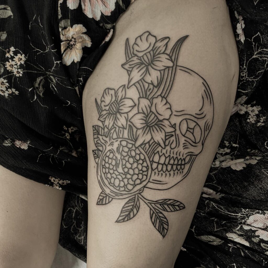 black Pomegranate tattoo with skull