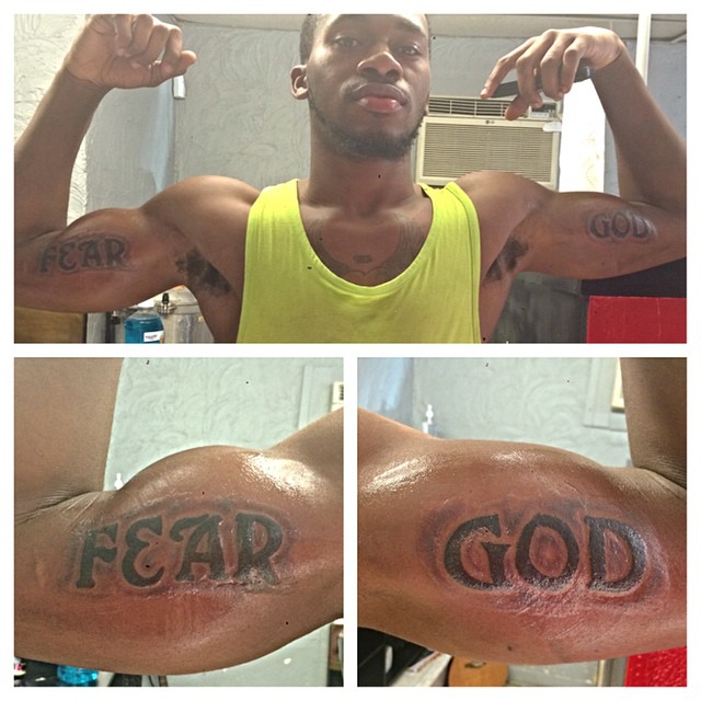 inner arm fear god tattoo