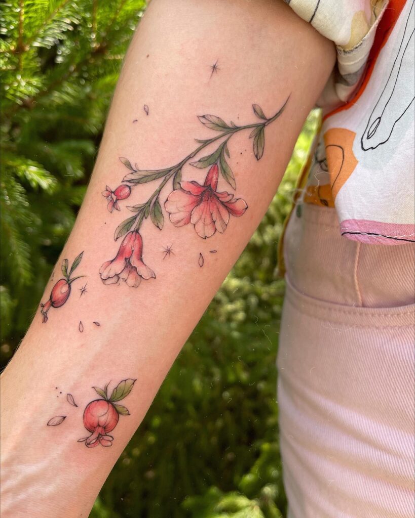 minimal and elegant Pomegranate tattoo