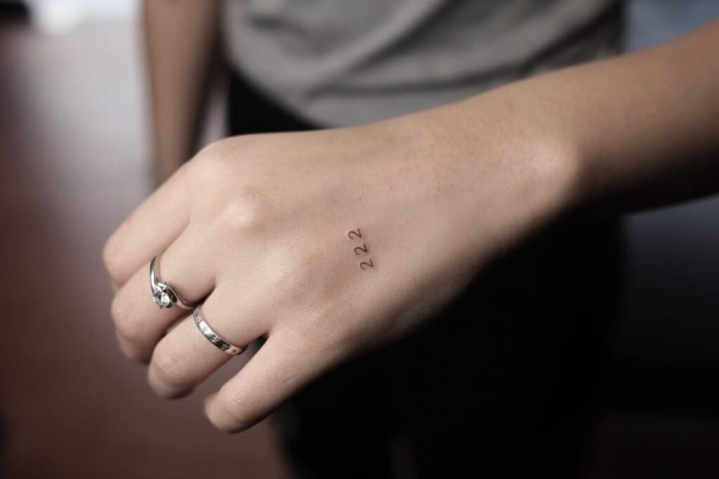 minimalistic 222 tattoo on hand