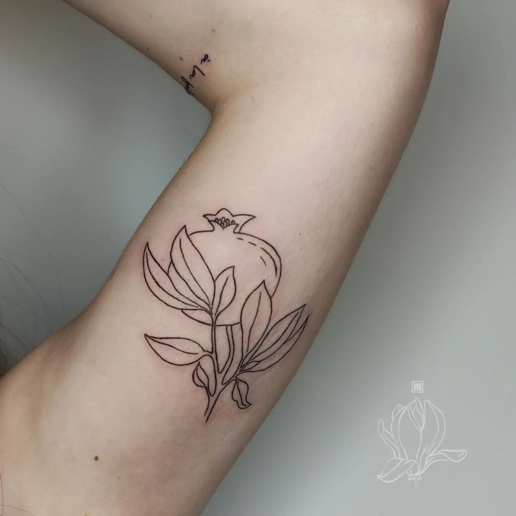simple and elegant Pomegranate tattoo