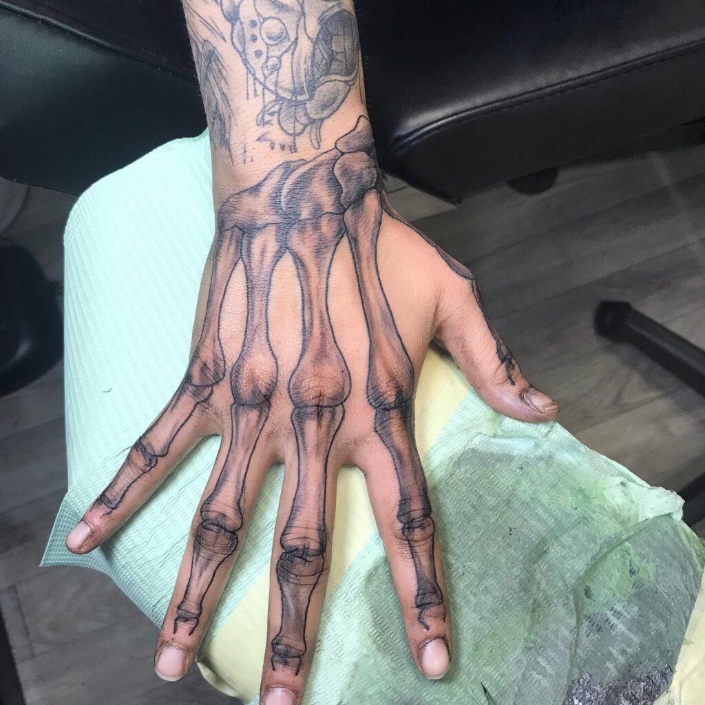 Fine Skeleton Hand Tattoo