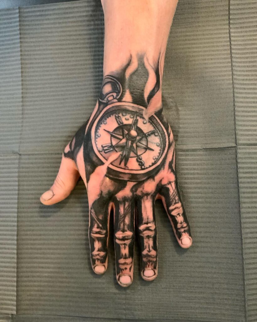 Skeleton Hand Tattoo with Compass