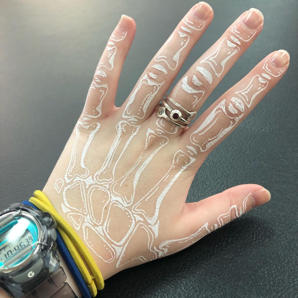 White Skeleton Tattoo on Hand