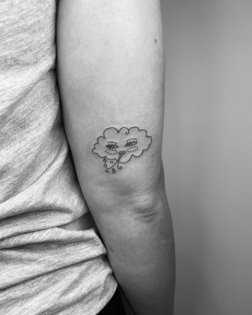 Cloud Tattoo on Outer Arm