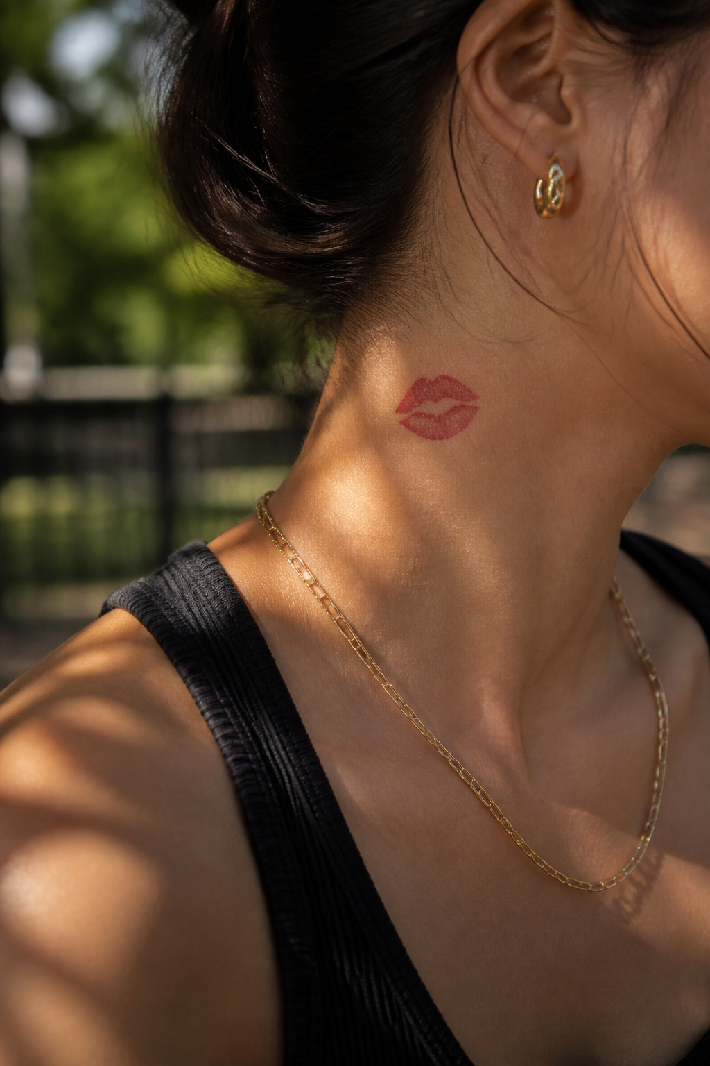 Lips Tattoo on Neck: 8 Design Ideas for 2026 1 A neck tattoo of red lips symbolizing intimacy and desire.