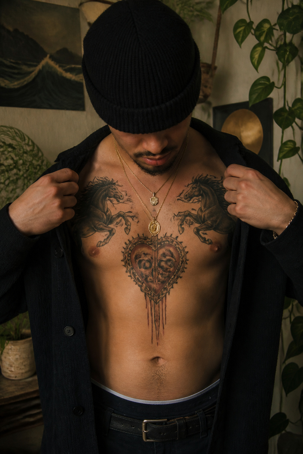 5 Bad Bunny Tattoo Placements on His Body (2026) 1 Close-up of Bad Bunny's chest tattoos including a heart and horses.