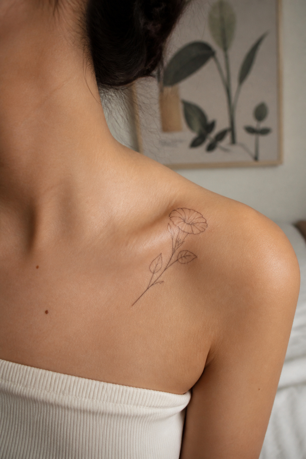 25 Morning Glory Tattoo Ideas for 2026 13 Outline tattoo of morning glory on collarbone.
