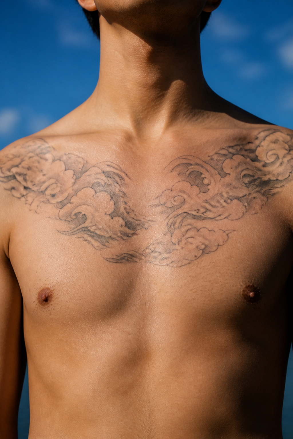 40 Cloud Tattoo Ideas for 2026: Japanese, Storm, Sleeve & More 21 Tattoo of clouds on the chest area.
