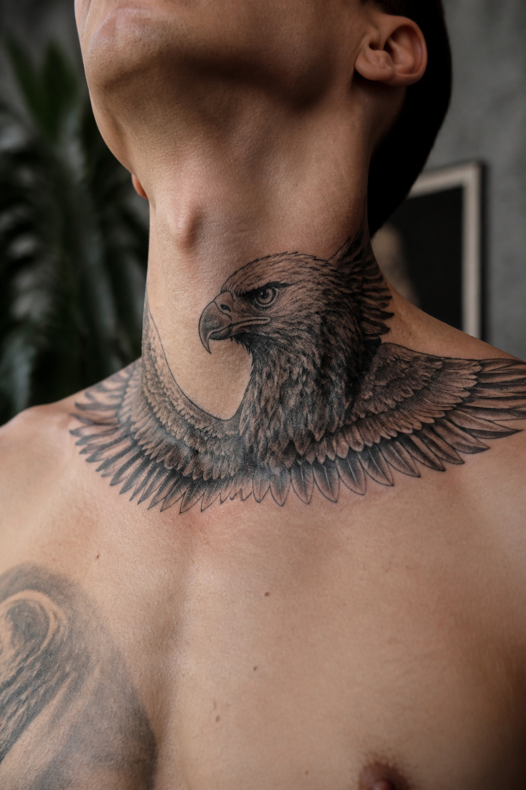 Eagle Tattoo Ideas for Men and Women: Designs and Styles 24 Eagle tattoo wrapping around the neck.