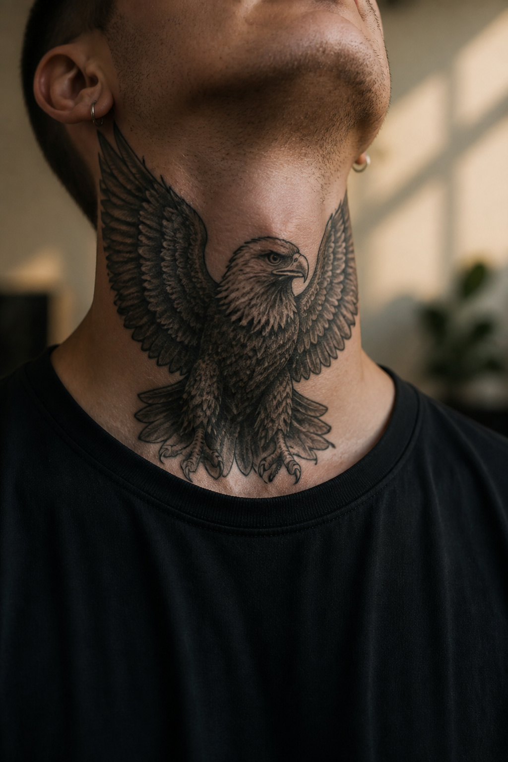 Eagle Tattoo Ideas for Men and Women: Designs and Styles 25 Eagle tattoo prominently displayed on throat.