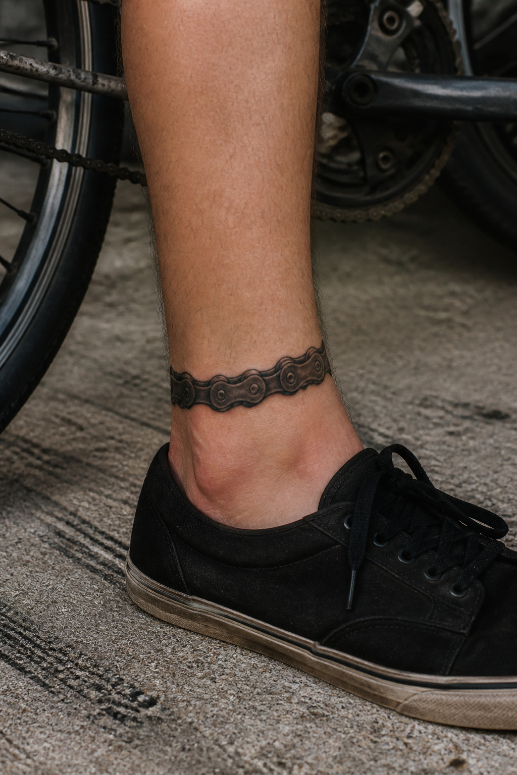 Bike Life Tattoo Ideas: 37 Designs for Cyclists in 2026 3 Detailed bike chain tattoo on an ankle.