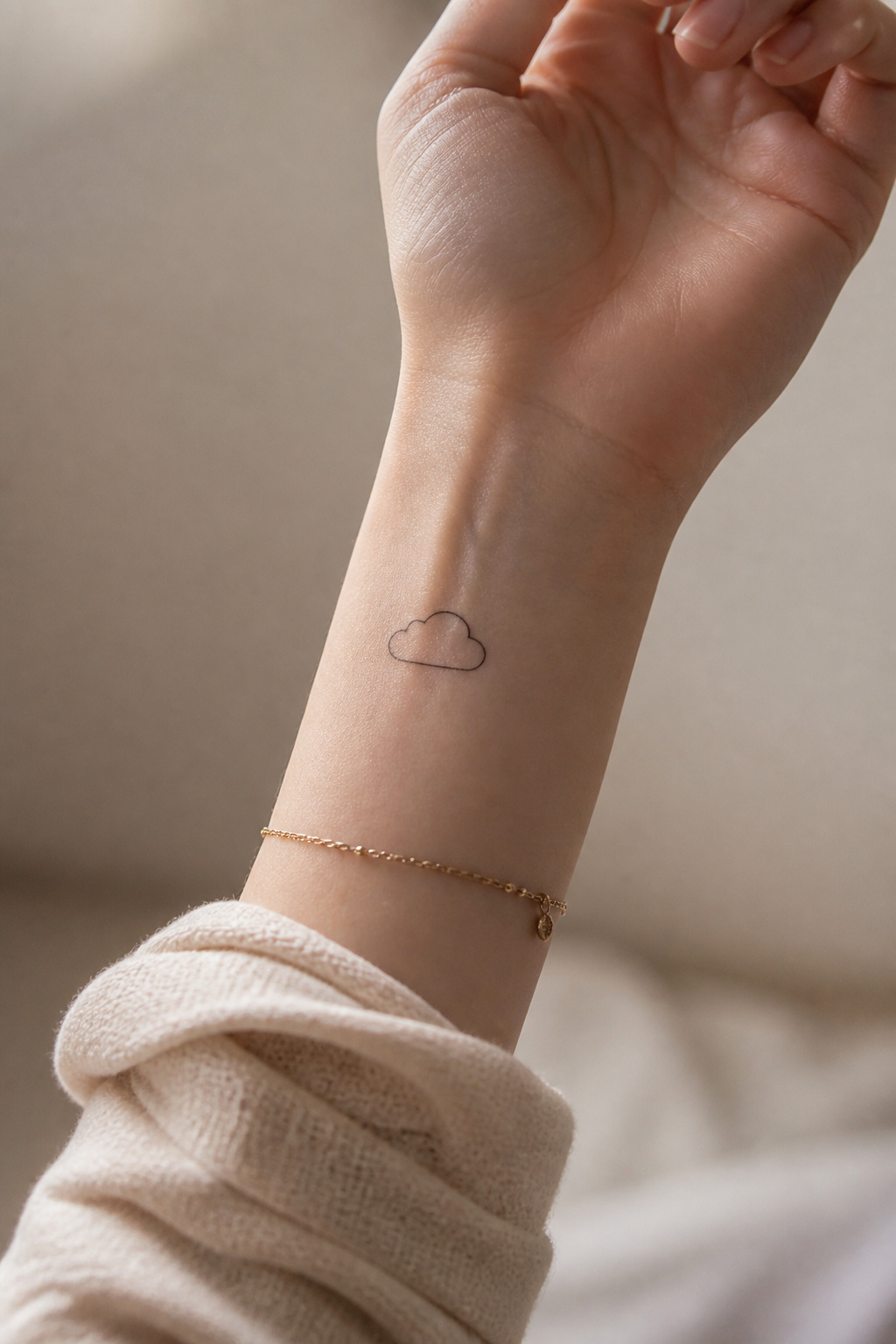 40 Cloud Tattoo Ideas for 2026: Japanese, Storm, Sleeve & More 4 Minimalist tattoo of a single outline of a cloud.
