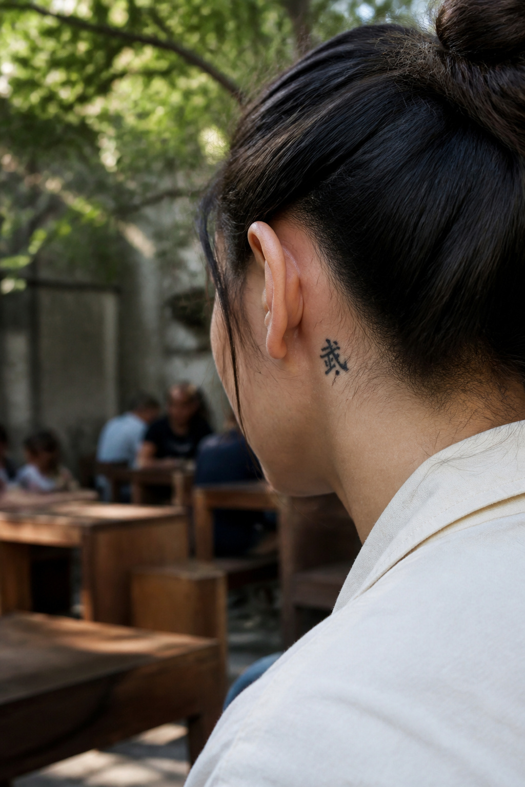 Martial Arts Tattoo Ideas: Karate Symbols, Black Belts and Personal Meaning 5 Small kanji character tattoo displayed behind the ear.