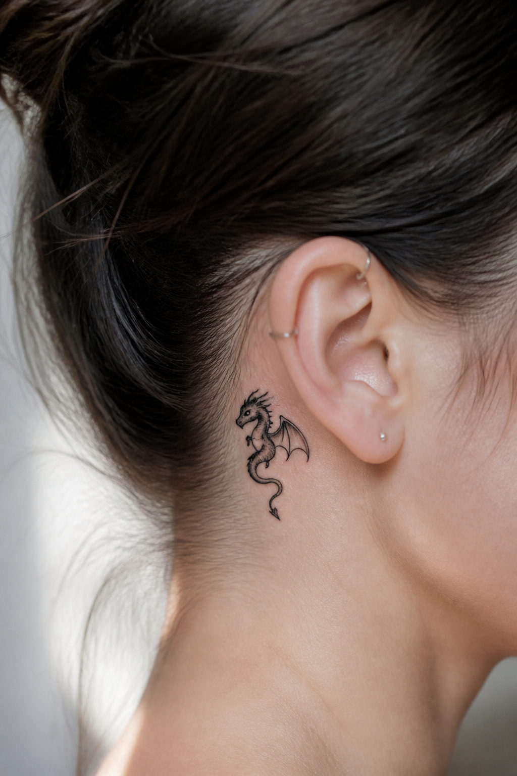 5 Dragon Tattoo Behind Ear Ideas: Styles for 2026 5 Stylized mini dragon tattoo behind the ear.