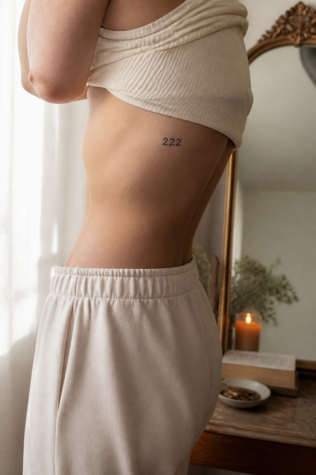 17 222 Tattoo Ideas and Meanings for 2026 7 A clear '222' tattoo inked on the side of a torso.