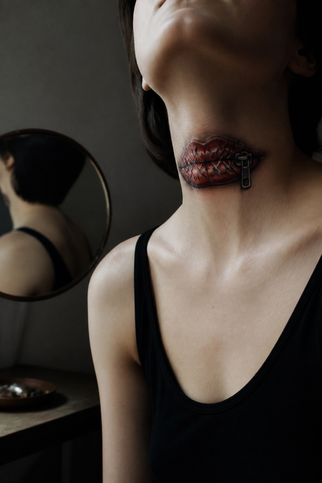 Lips Tattoo on Neck: 8 Design Ideas for 2026 8 A tattoo of stitched lips on the neck, conveying themes of silence.