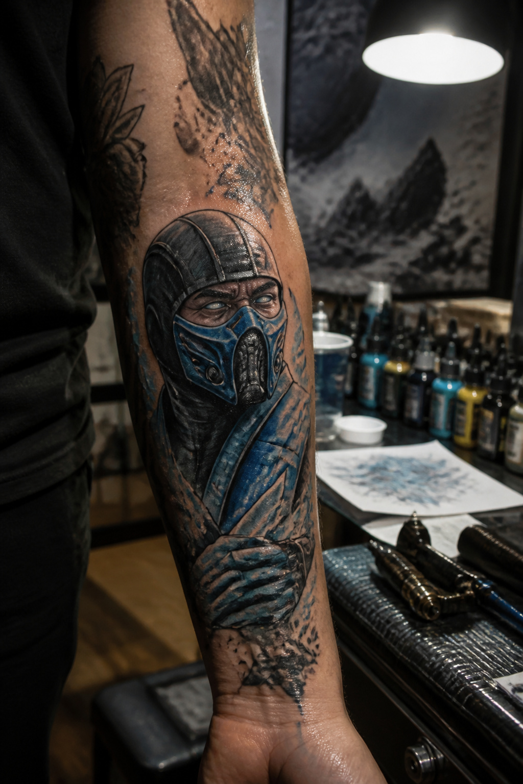Mortal Kombat Tattoo: Fighter Art, Fatalities, Logo and Custom Ink 9 A close-up of a Sub-Zero tattoo on a person's forearm.
