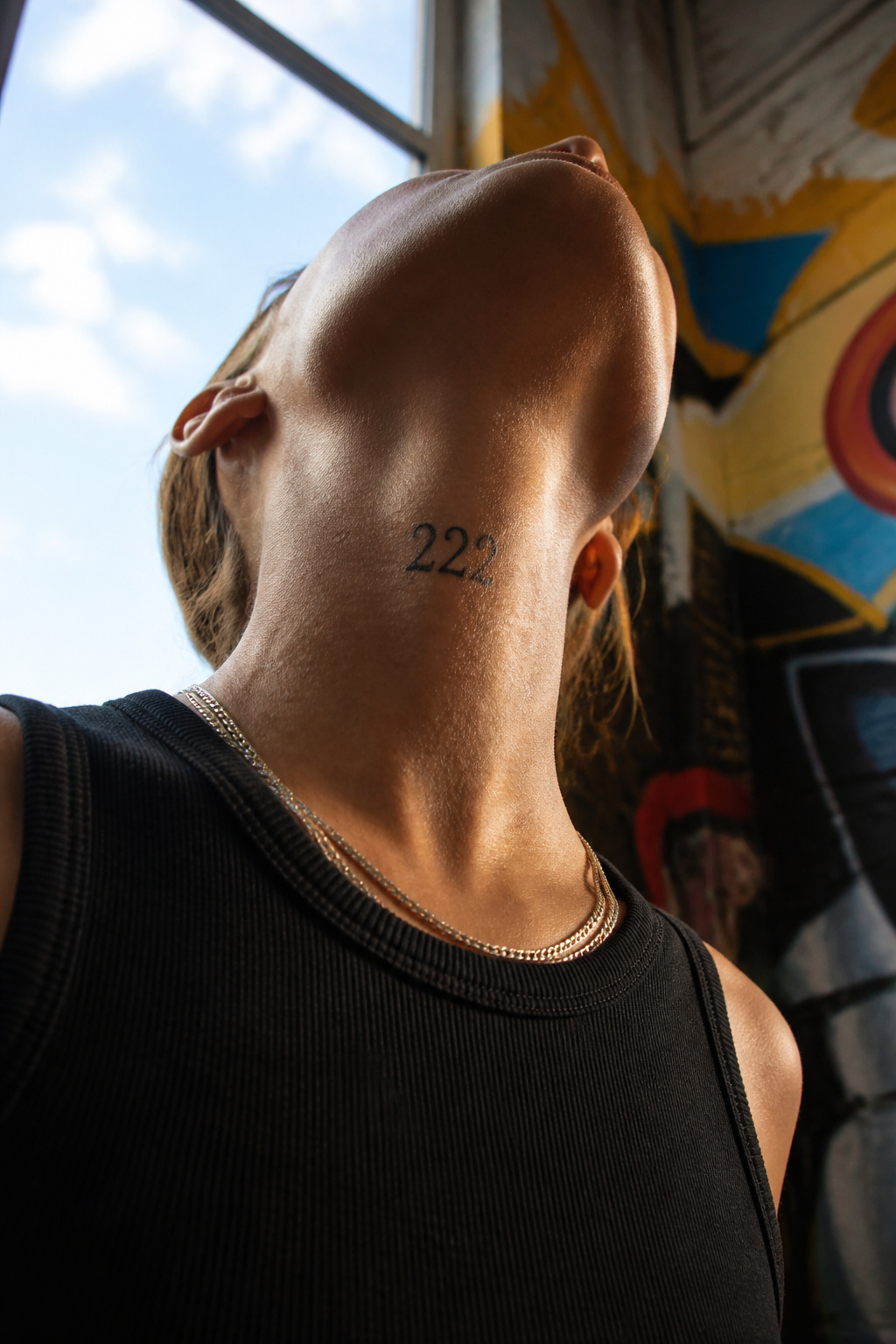 17 222 Tattoo Ideas and Meanings for 2026 9 A '222' tattoo prominently displayed on the neck.