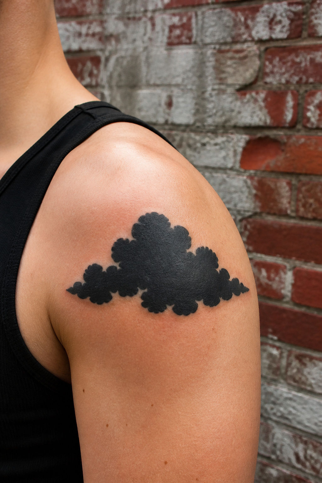 40 Cloud Tattoo Ideas for 2026: Japanese, Storm, Sleeve & More 9 Heavy black cloud tattoo with solid graphic edges.