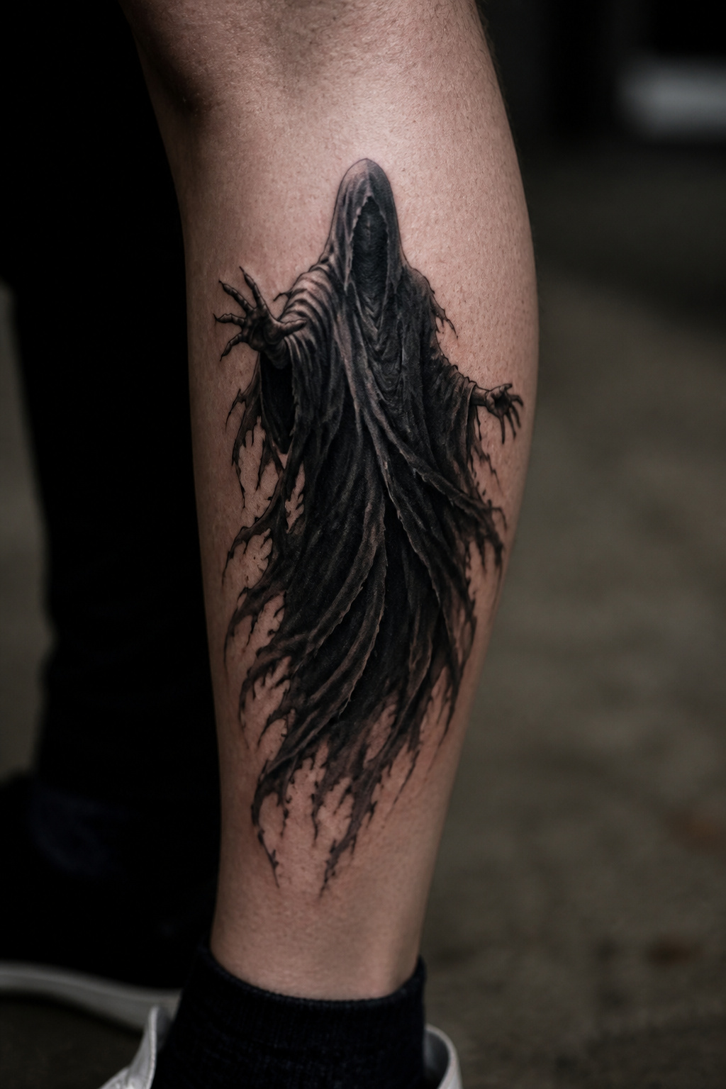 Tattoo of a Dementor in a hooded cloak.